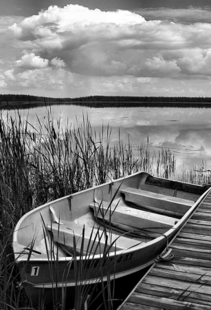 Boat, clouds in black and white