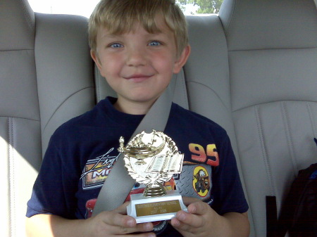 Matthew is so proud of his straight A's award!