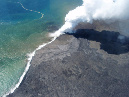 Skyview of lava flowing in the ocean