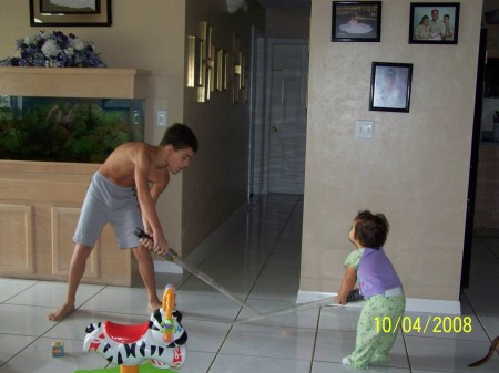 Julian and Brianna sword fighting.