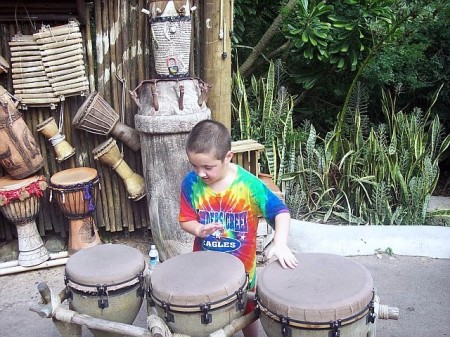 DANIEL POUNDING ON THE DRUMS AT MAGIC KINGDOM