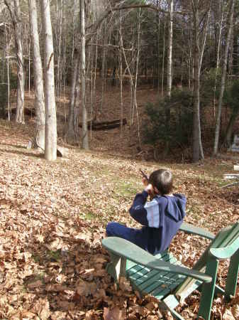 Brian-shooting his gun in our backyard