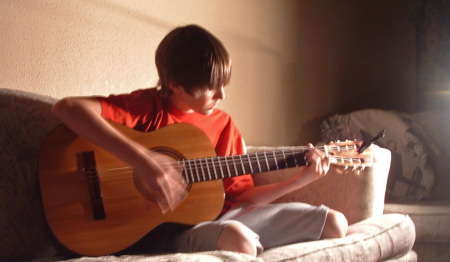 Isaac on the guitar