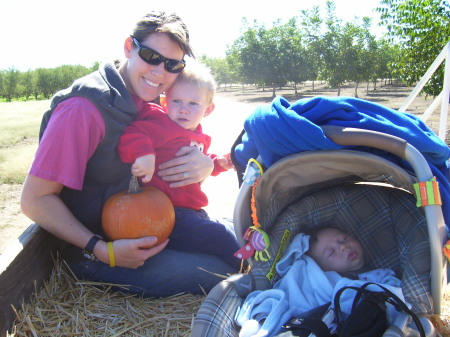 Mom pickin' pumpkins with the 2 boys:-)