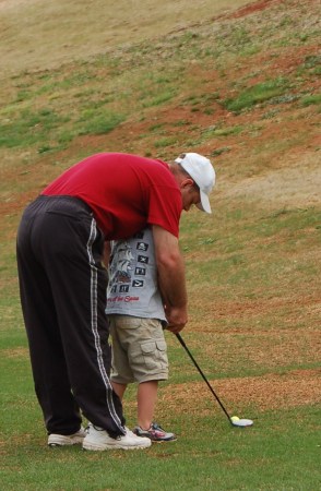 daddy givin' cpl a little help with his swing!