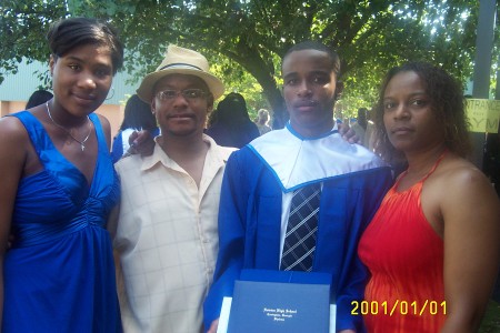 My Husband "Thane" & I with two of the Grads