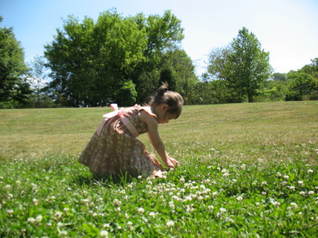 Bria picking flowers