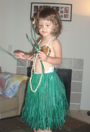 Granddaughter Izzy in grass skirt from Hawaii