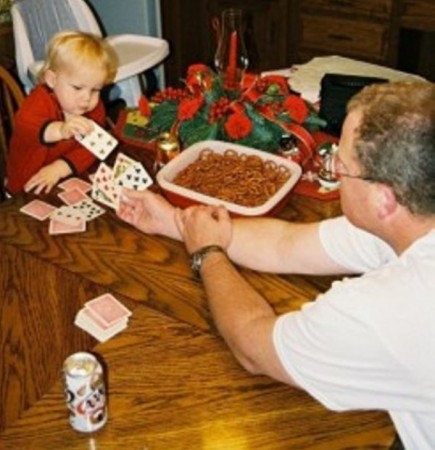 Grandson Will playing cards with Uncle Jeff