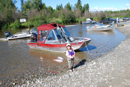 Emma with her coho's by dads boat 2008