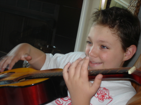My son, Ira playing guitar