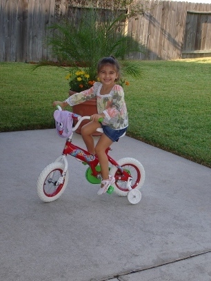 Sienna Riding her Dora Bike