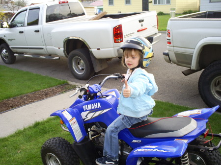 Alanna riding her 4wheeler 3 years old