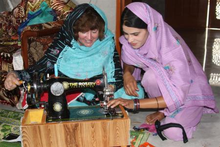Helen sewing in Pakistan