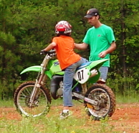 daddy helping lil rob on the dirtbike