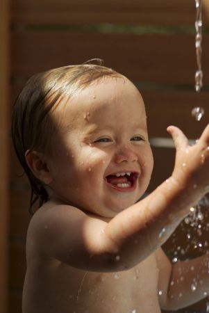 Eliana playing with water