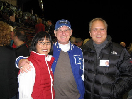 Janice, Tim with Coach Harris