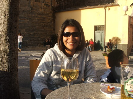 Lovely wife enjoying wine in Italy