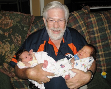 Grandpa Steve holding his 8th & 9th grandkids