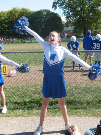 Tori cheerling at West game