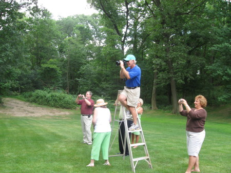 Spouses taking group picture