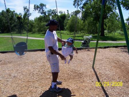 Kyl swinging for the first time with daddy