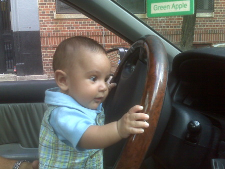 My brilliant grandson driving at 3 months