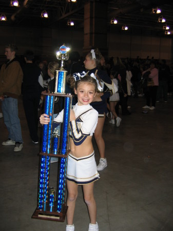 My daughter, Lexi, and her first place trophy
