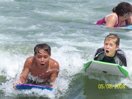 Colin and his friend having fun at the beach