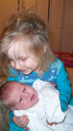 christianna holding her new sister 3/20/08