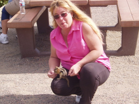 Cathy feeding a chipmunk