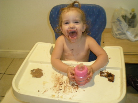 Aleesia eating her birthday cookie cake