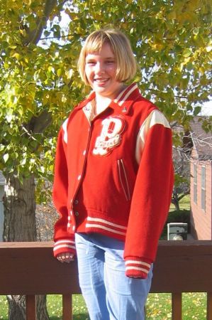 Granddaughter in my high school jacket