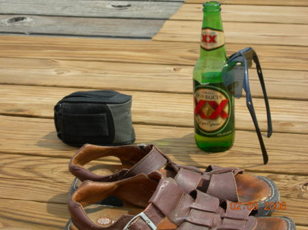 Beer,sunglasses,camera,sandals the good life