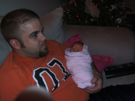 My husband and daughter when she was 6 days