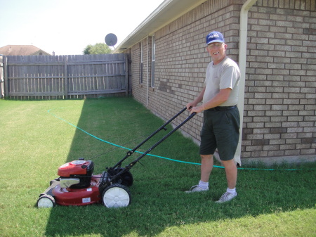 Cutting the back yard grass, Aug. 2010