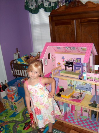 Sydney age 4 and her new doll house