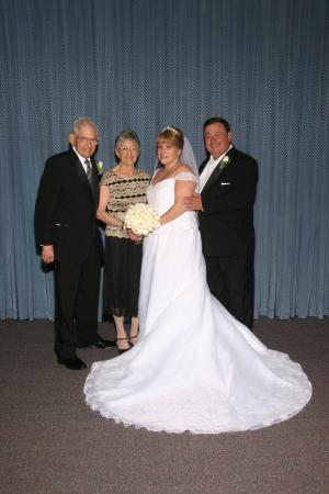 Monica and me with my parents at our wedding