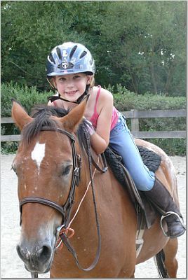 My youngest on her horse Louie