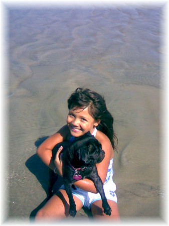 Kiana and her pug at the beach