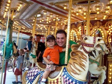 Niko & Dad at on the merry go round