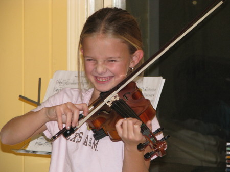 Sydney playing the violin