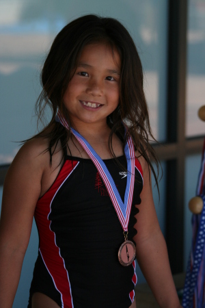 Riley with her Gold Medal in diving