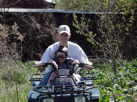 Jay & Dylan riding in the back pasture