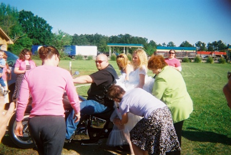 Katrina's mother Beccy trying to fix her dress