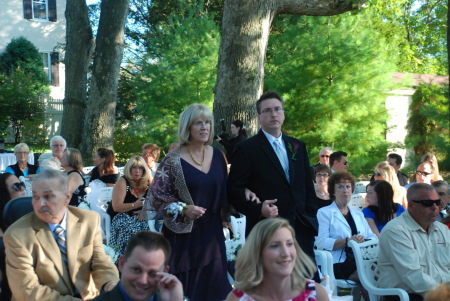 Joy being walked down the isle by the Best Man