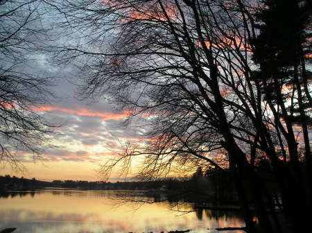 sun setting over a lake from my patio