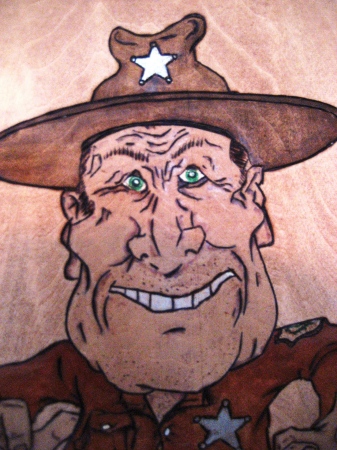 Close-up of "County Mountie" pyrography