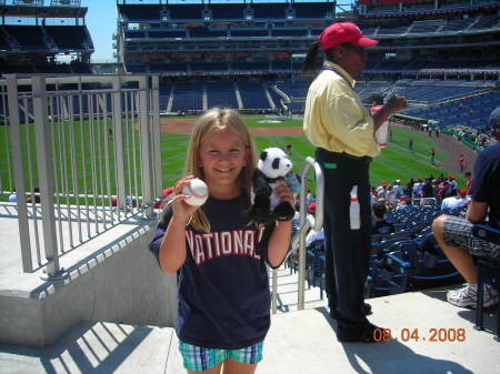 Kylee at the Nationals game with her catch