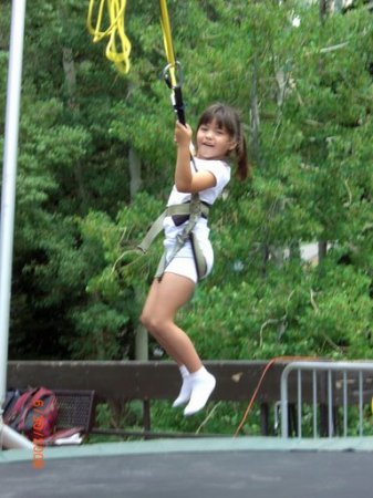 Kayleigh bungees on the trampoline